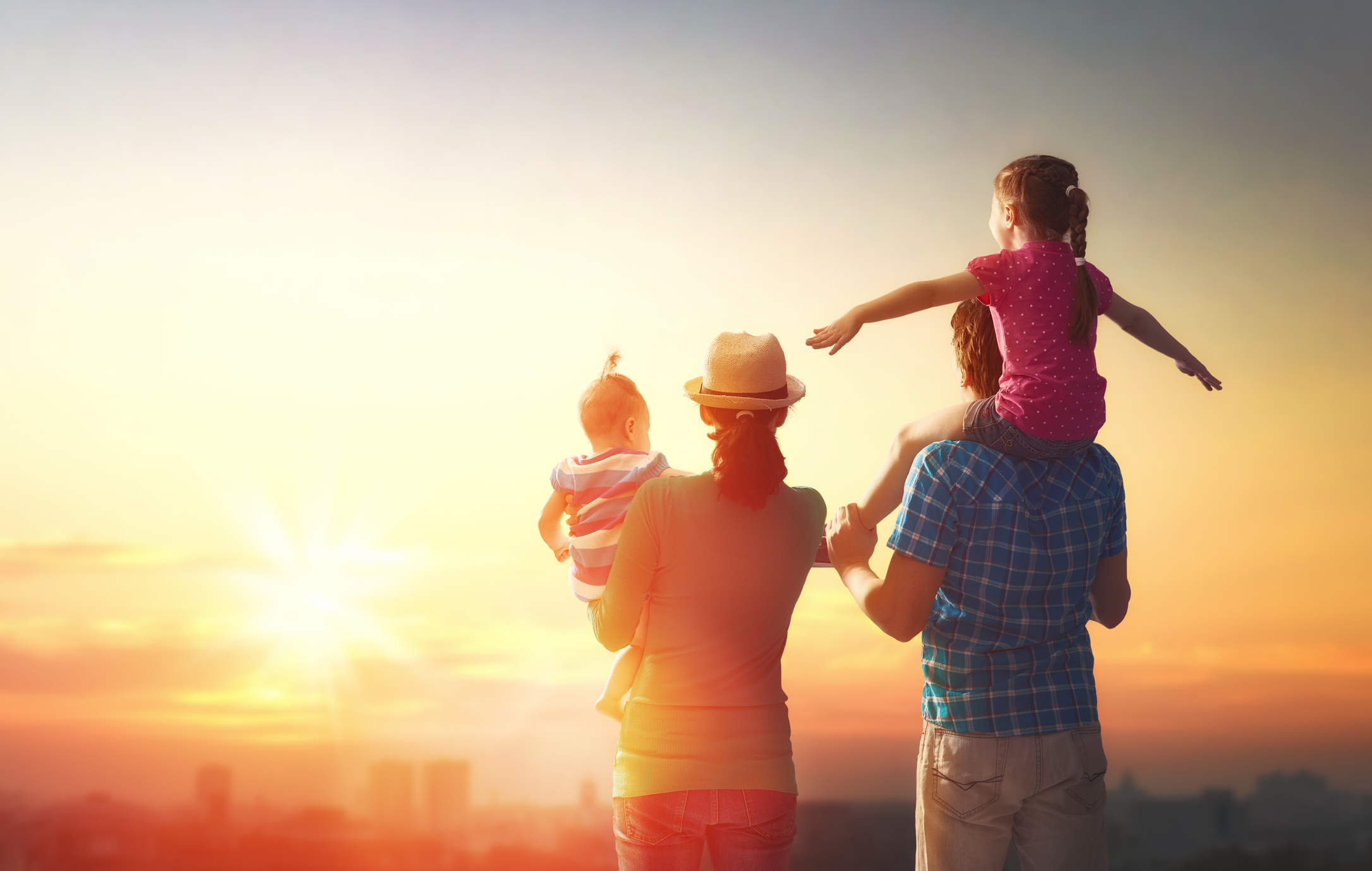 happy family at sunset.